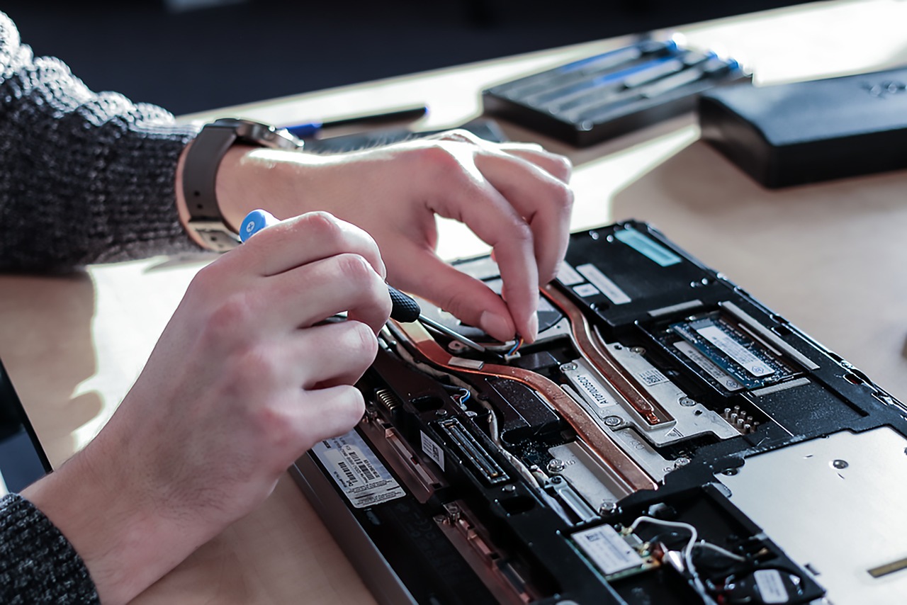 Technician repairing a laptop